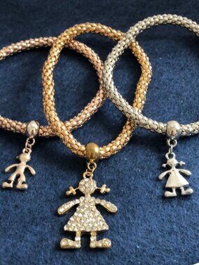 3 coloured bracelets stretched with pendents